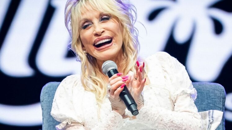 Dolly Parton celebrates Dollywood's first opening day.