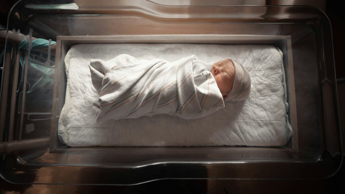 newborn baby in cradle