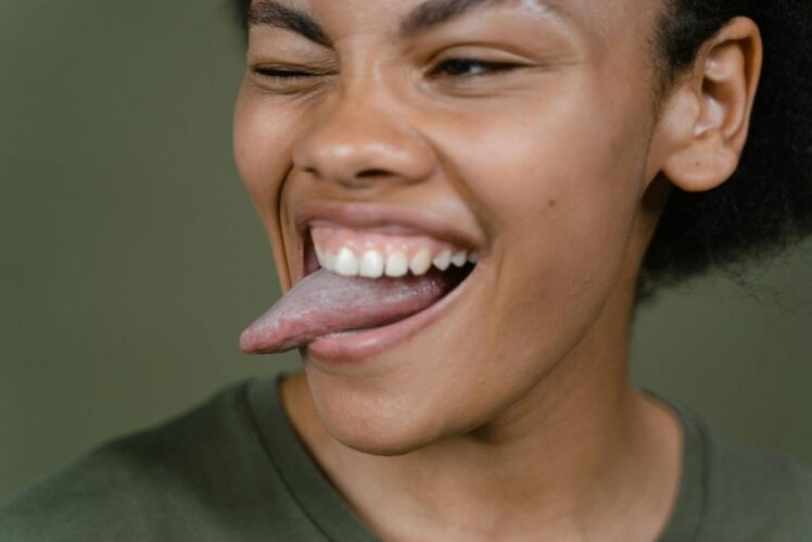 Woman with her tongue out.