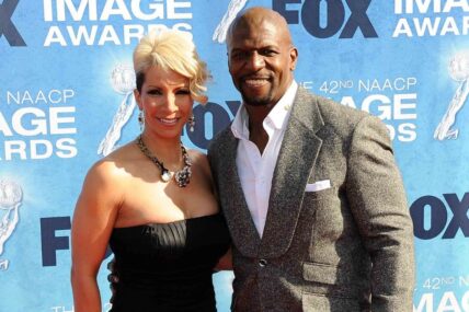 Terry Crews (right) and wife Rebecca arrive at the 42nd NAACP Image Awards