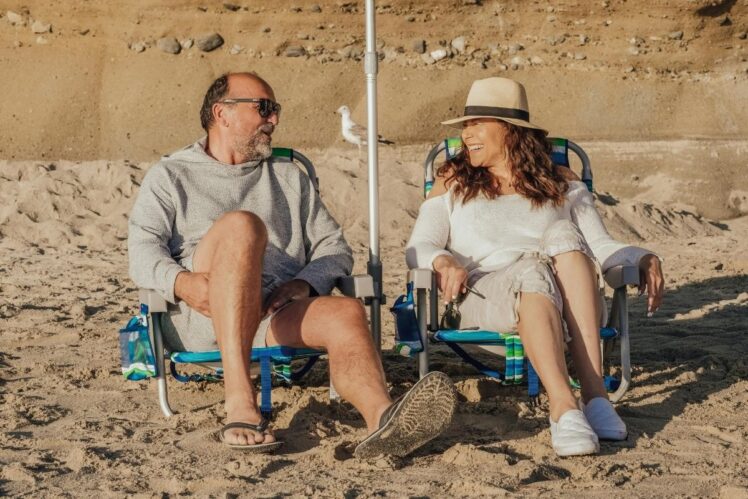 Two people in shade on sunny day