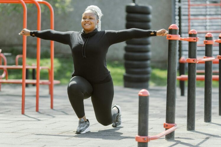 Woman stretching in park.