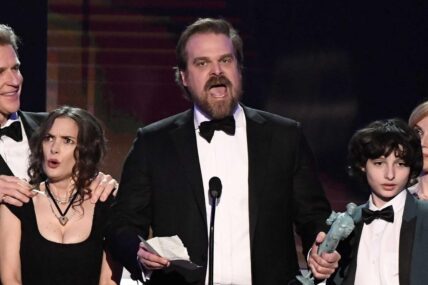 David Harbour speaks as cast members of Stranger Things (Netflix) accept award