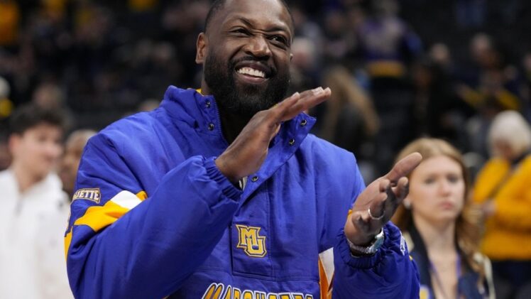 Former Marquette player Dwyane Wade looks on prior to the game against the Butler Bulldogs at Fiserv Forum